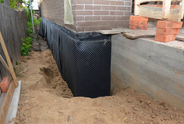 Happy homeowners after waterproofing job in Arkdale
